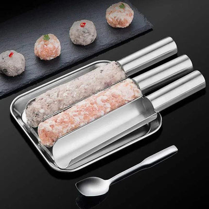 Triple Meatball Maker Stainless Steel on a tray with a spoon on a black background