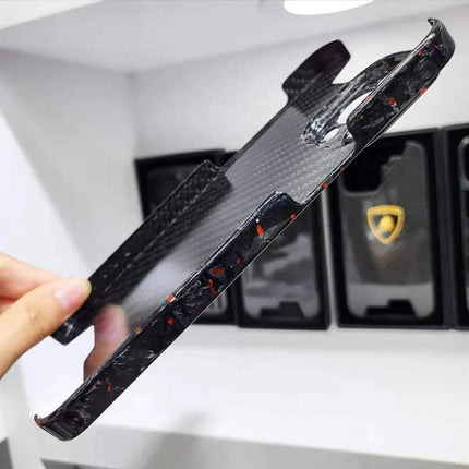 Ultra Thin Forged Carbon Fiber Cover For iPhone held by a hand with Lamborghini logo in the background