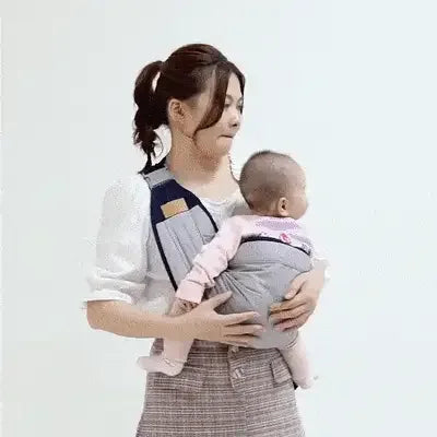 A mother holds her baby securely in a Baby Shoulder Carrier, showcasing comfort and support.