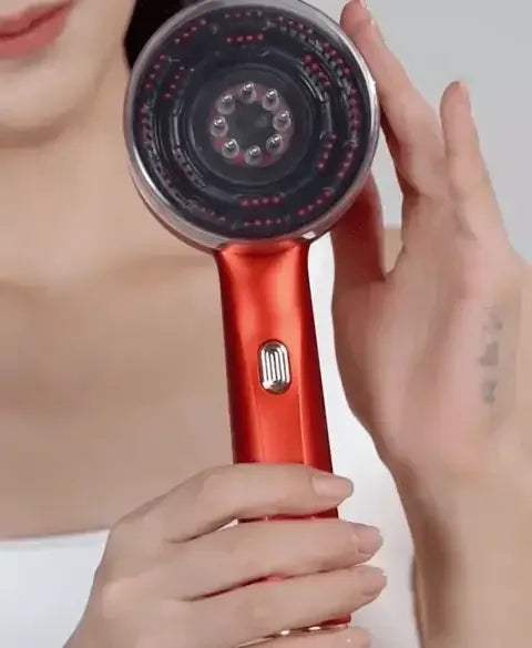 Electric Scalp Massager held by a person, designed for hair growth and relaxation.