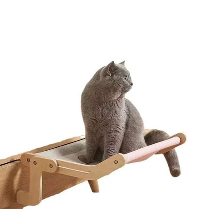 Gray cat sitting on a Sturdy Hanging Cat Bed with pink cushion on a white background