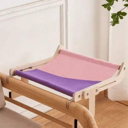 Sturdy Hanging Cat Bed with pink and purple cushion in a room setting