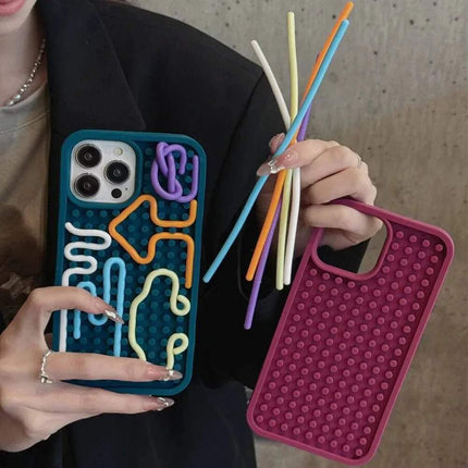 A person holding a Stress-Relieving Phone Case with colorful tactile features for anxiety relief.