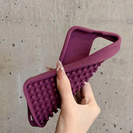 Hand holding a Stress-Relieving Phone Case with textured design for stress relief and tactile engagement.