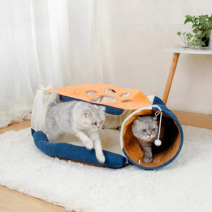 Two cats playing with the Pet Cats Tunnel Toy on a white rug.