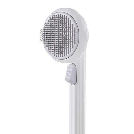 Pet Brush Comb Self-Cleaning Grooming Tool with a white background