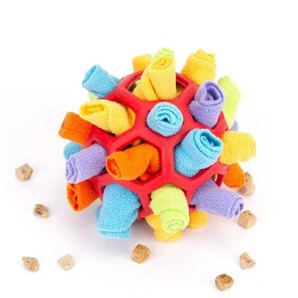 Pet Snuffling Ball Toy with textured surface and small bones around on a white background