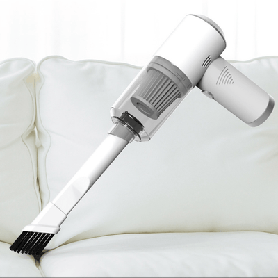 White handheld vacuum mite remover with brush attachment on a white background