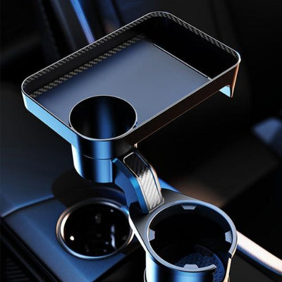 Blue car cup holder tray with additional compartments on a dark background