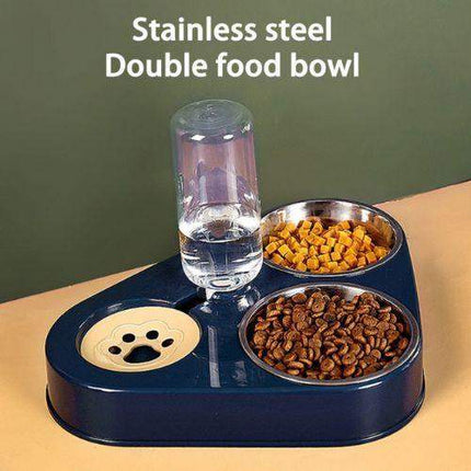 Pet Food Bowls 3 in 1 Ergonomic & Safe Feeding Solution Stainless steel double food bowl with water bottle on a beige surface and green background