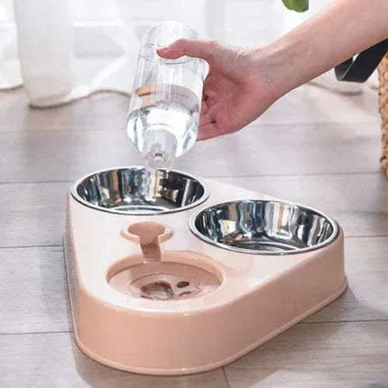 Pet Food Bowls 3 in 1 Ergonomic & Safe Feeding Solution with water being poured into it on a light wooden floor.