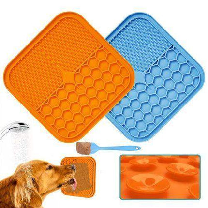 Orange and blue Slow Feeder Mat for Pets with honeycomb pattern, dog drinking water, and additional mat inset.