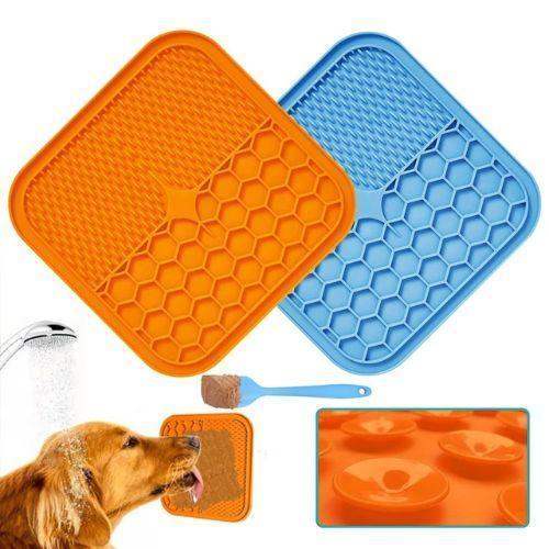 Orange and blue Slow Feeder Mat for Pets with honeycomb pattern, dog drinking water, and additional mat inset.