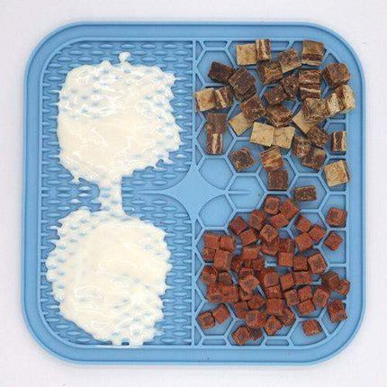 Slow Feeder Mat for Pets with white and brown dog treats on a white background
