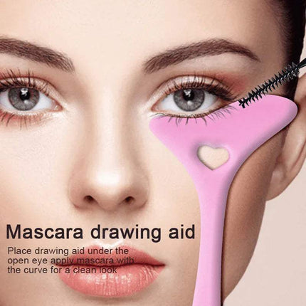 Silicone Eyeliner Makeup Stencil  use as a Mascara drawing aid with a heart-shaped window on a beige background