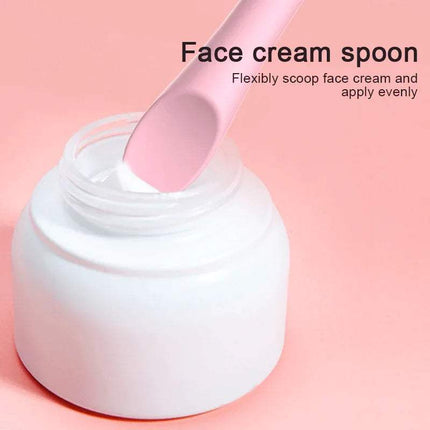 Silicone Eyeliner Makeup Stencil use as a Face cream spoon with a jar of cream on a pink background