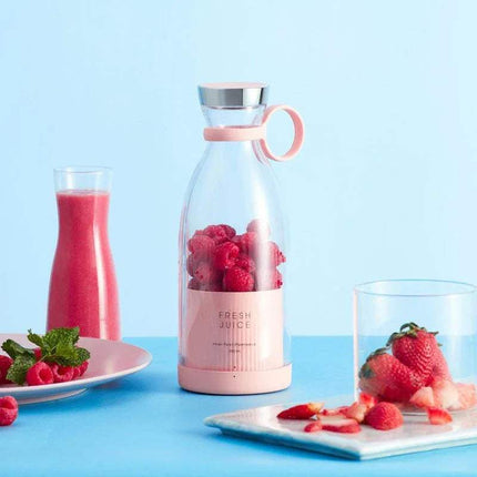 Portable Electric Blender Fruit Juicer & Mixer Fresh Smoothies Anytime, Anywhere with raspberries, pink smoothie, and strawberries on a blue background