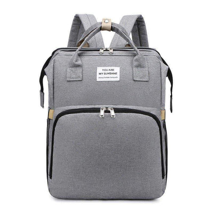 Light Gray Baby Diaper Backpack  with a visible brand label on a white background