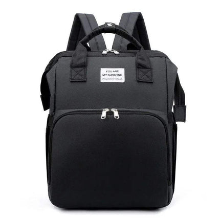 Black Baby Diaper Backpack with a visible label on a white background