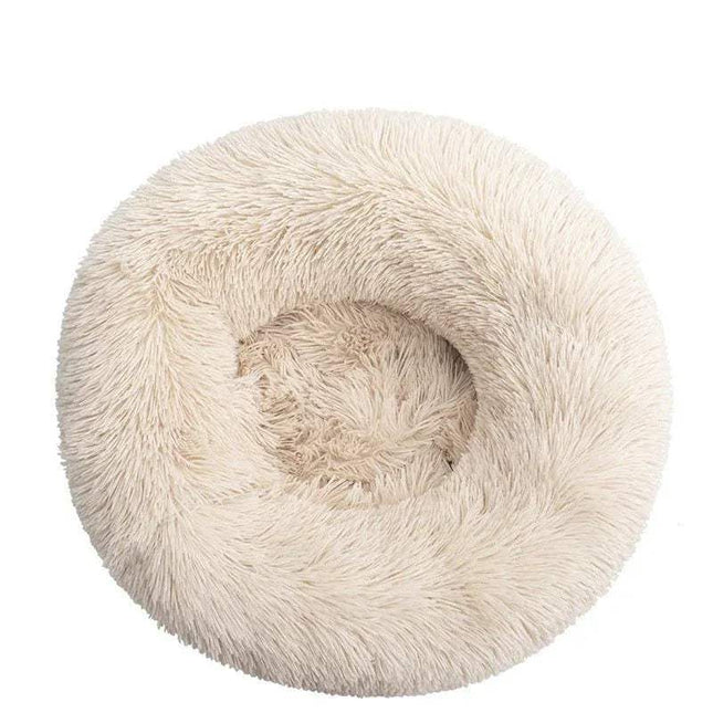 Comfortable Donut Bed for Pets in soft beige color, designed for cozy and supportive relaxation for small pets.
