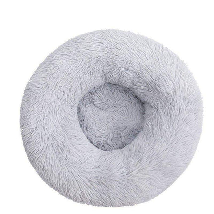 Comfortable Donut Bed for Pets in soft gray color, cozy and supportive for small dogs and cats.