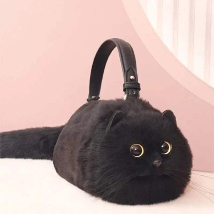 Black Ultra-Soft Convertible Cat Handbag Stylish & Playful Feline-Inspired Bag on a pink background