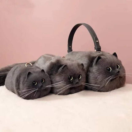 Gray Ultra-Soft Convertible Cat Handbag Stylish & Playful Feline-Inspired Bag with three cat faces on a pink background