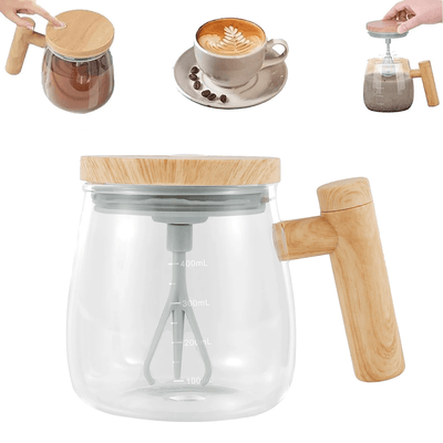 Glass coffee maker with wooden handle and lid, surrounded by coffee cup and beans.