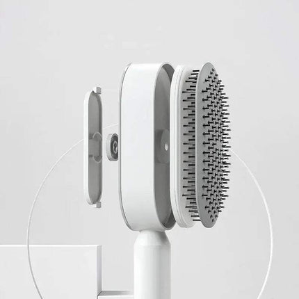 White Ergonomic Hair Brush with bristle head on a light gray background