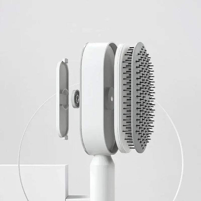 White Ergonomic Hair Brush with bristle head on a light gray background