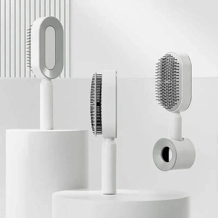 Set of Ergonomic Hair Brush including a brush, scrubber, and holder on a white background