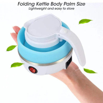 Folding Kettle & Water Heater  held in a hand with green leaves around it on a white background.