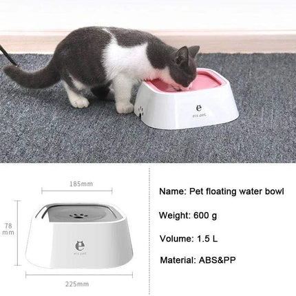 Cat drinking from a Pet Floating Bowl on a textured surface