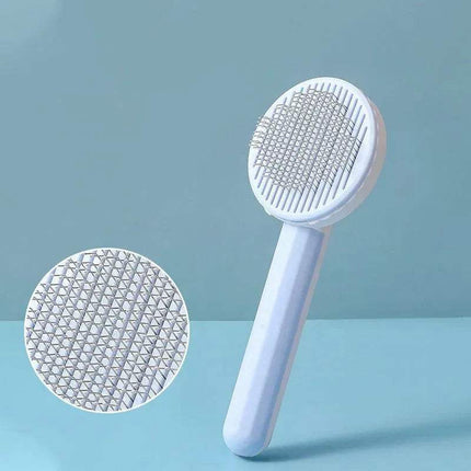 White Self-Cleaning Pet Brush Gentle Grooming & Undercoat Removal with textured head on a light blue background