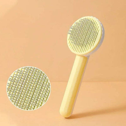 Yellow Self-Cleaning Pet Brush Gentle Grooming & Undercoat Removal with close-up inset on a beige background