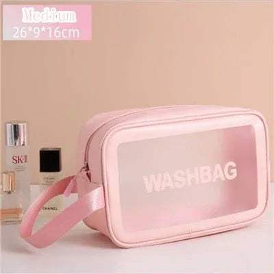 Pink Portable Transparent Waterproof Travel Wash & Makeup Bag with 'WASHBAG' text on a beige background