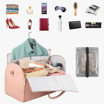 Women Large PU Folding Suit Storage Bag pink with various travel items displayed around it on a white background