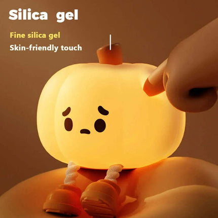 Cute Pumpkin Night Light with a cartoonish design, glowing softly.
