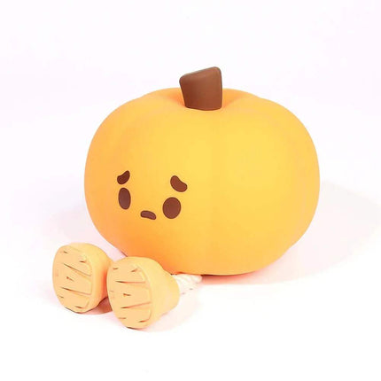 Cute Pumpkin Night Light with a sad face on a white background