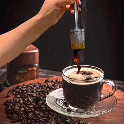 Reusable Coffee & Tea Filter with coffee beans and a jar in the background.